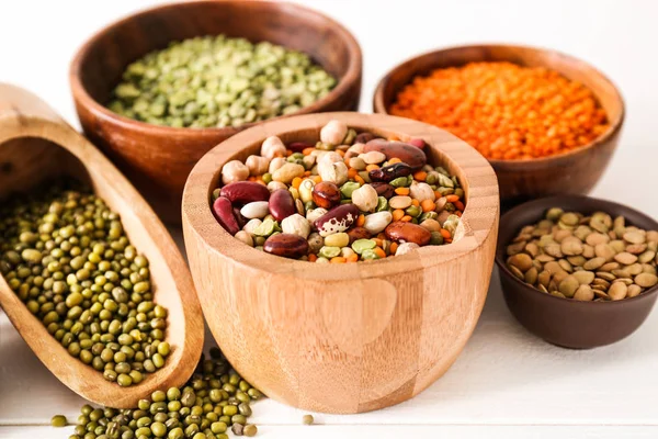 Assortment of legumes on white table — Stock Photo, Image