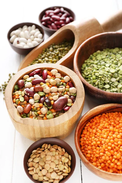 Assortment of legumes on white table — Stock Photo, Image