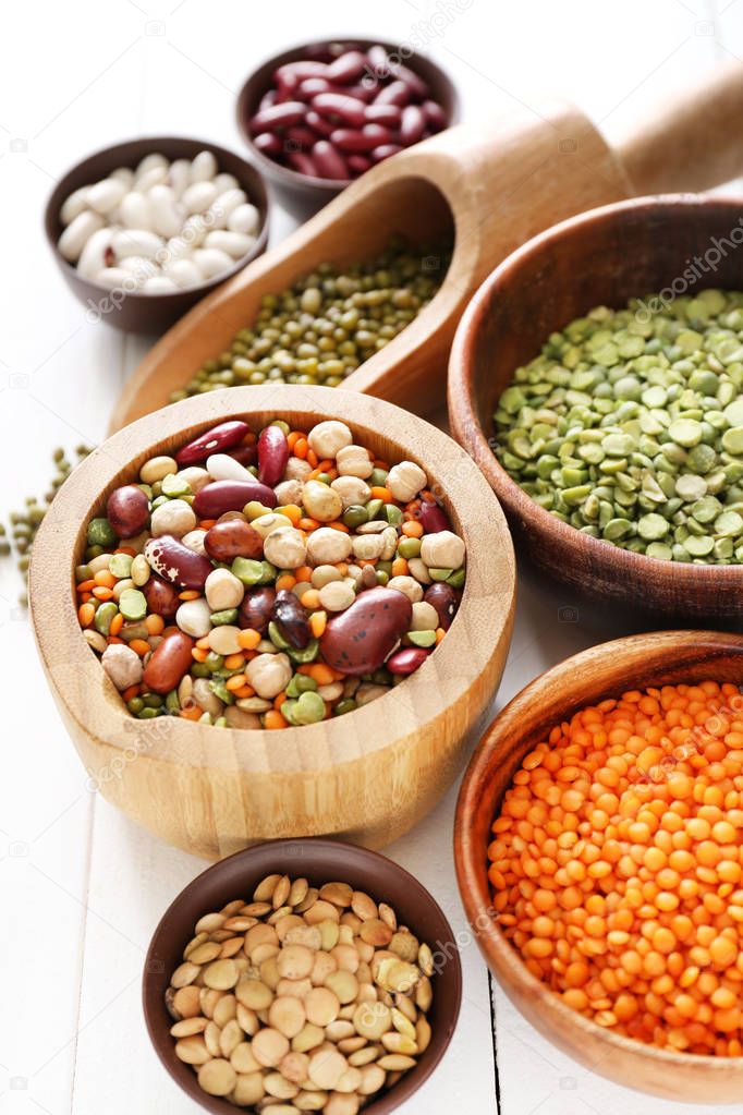 Assortment of legumes on white table