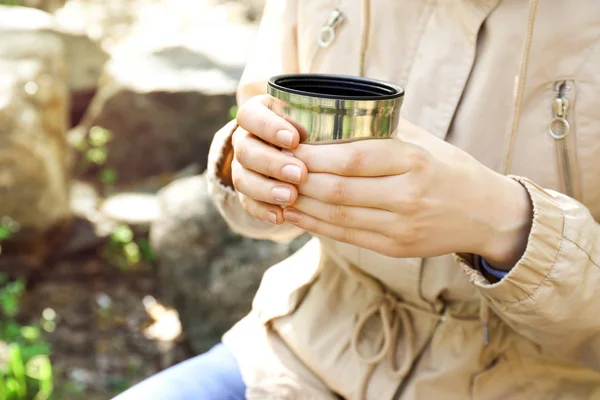 Female tourist drinking tea in forest, closeup — Stock Photo, Image