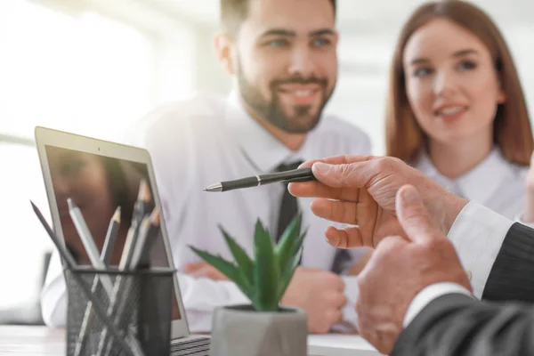 Couple meeting with notary public in office