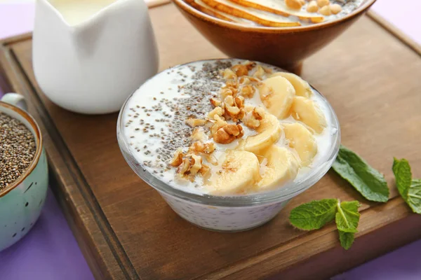 Bowl with tasty chia dessert on wooden board — Stock Photo, Image