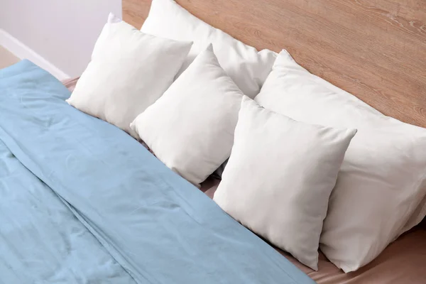 Cozy bed with soft pillows — Stock Photo, Image