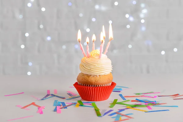 Tasty Birthday cupcake on white table — Stock Photo, Image