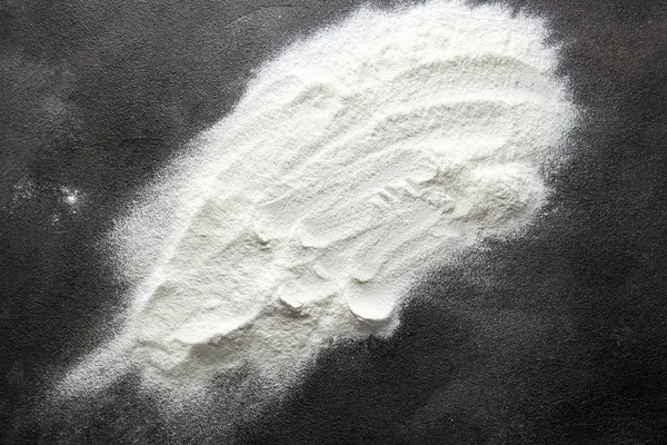 Fresh flour on dark background — Stock Photo, Image