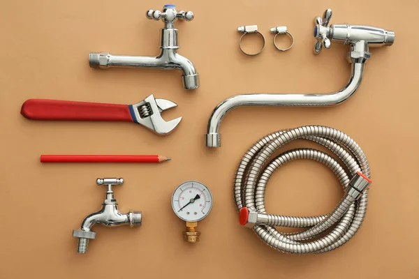 Set of plumbing items on color background — Stock Photo, Image