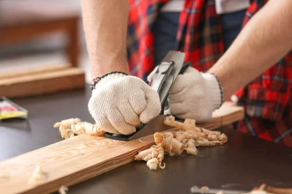 Male carpenter working in shop, closeup — Stock Photo, Image