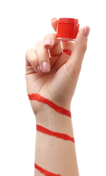 Painted female hand with jar on white background — Stock Photo, Image