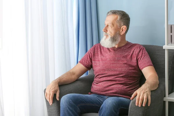 Portrait of mature man at home — Stock Photo, Image
