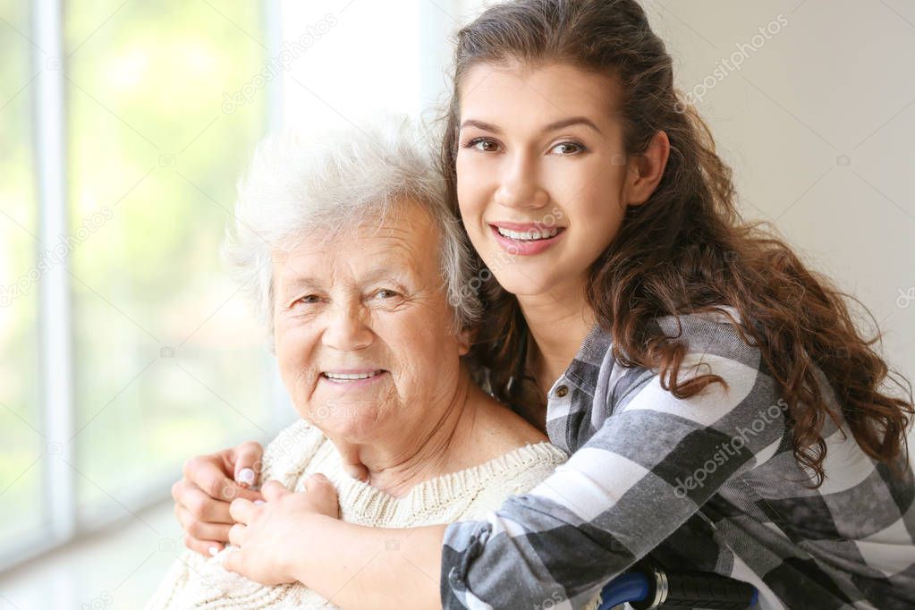 Senior woman with her granddaughter in nursing home