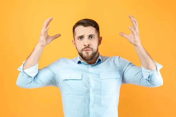 Stressed man on color background — Stock Photo, Image