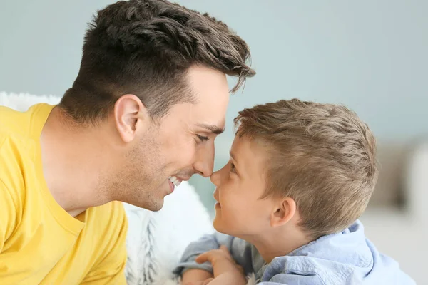 Portrait of happy father and son at home — Stock Photo, Image