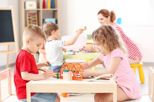 Cute little children playing in kindergarten — Stock Photo, Image