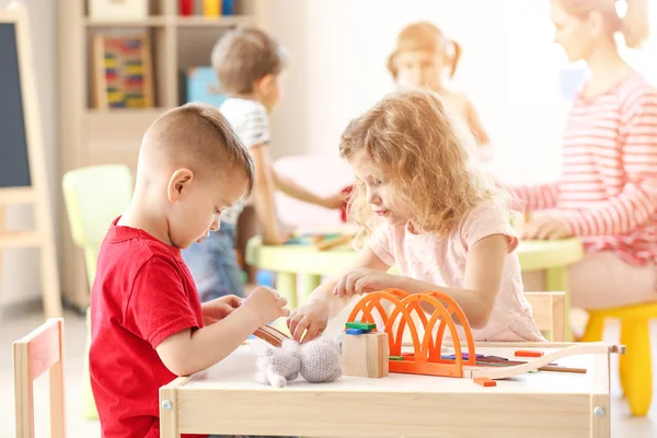 Cute little children playing in kindergarten — Stock Photo, Image