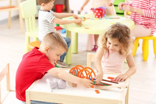 Cute little children playing in kindergarten — Stock Photo, Image