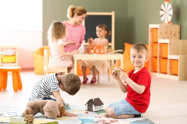 Cute little children playing in kindergarten — Stock Photo, Image