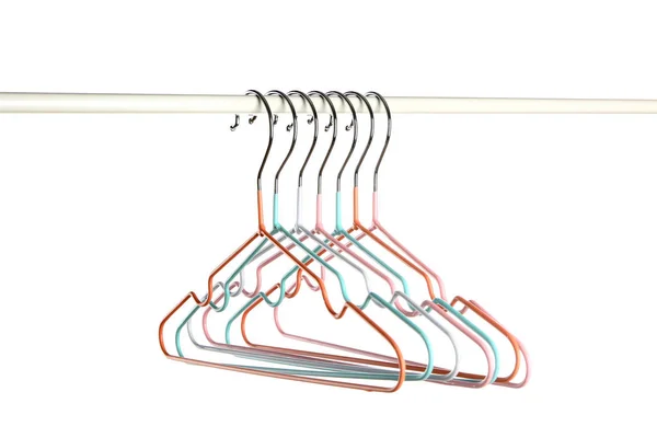 Rack with clothes hangers on white background — Stock Photo, Image