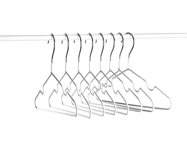 Rack with clothes hangers on white background — Stock Photo, Image