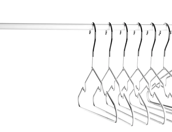 Rack med kläder hängare på vit bakgrund — Stockfoto