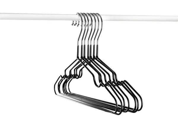 Rack with clothes hangers on white background — Stock Photo, Image