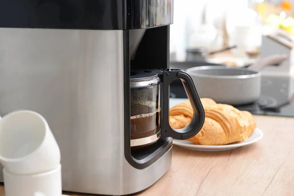 Modern coffee machine on kitchen table, closeup — Stock Photo, Image