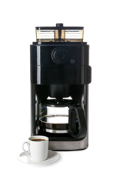 Modern coffee machine with cup on white background