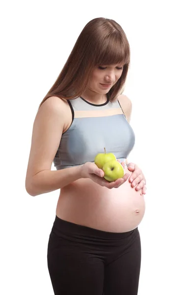 Beyaz arka planda elma ile güzel hamile kadın — Stok fotoğraf