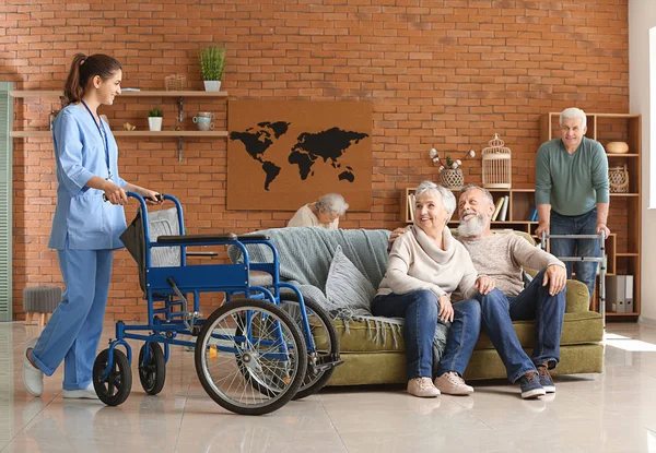 Elderly people with caregiver in nursing home