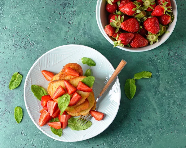 Plate with tasty French toasts and strawberry on color background — Stock Photo, Image