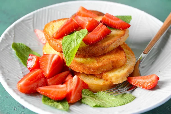 Tasty French toasts and strawberry on plate, closeup — Stock Photo, Image