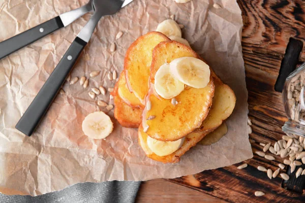 Tasty French toasts with banana on table — Stock Photo, Image