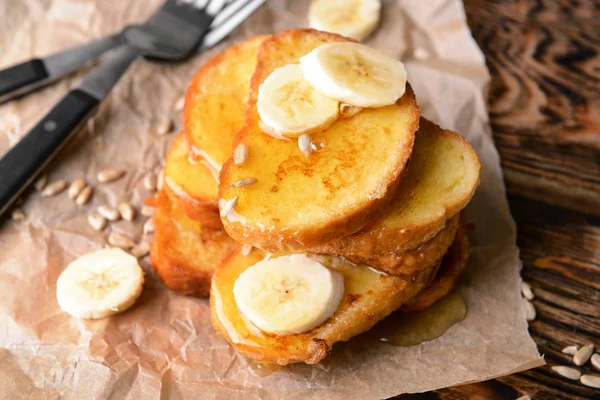 Tasty French toasts with banana on table — Stock Photo, Image