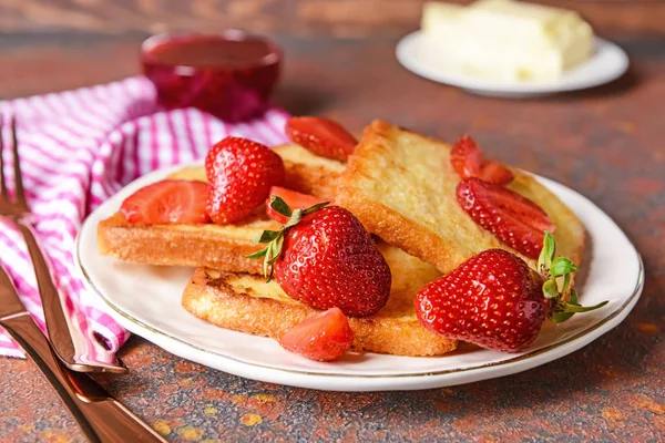 Plate with tasty French toasts and strawberry on table — Stock Photo, Image
