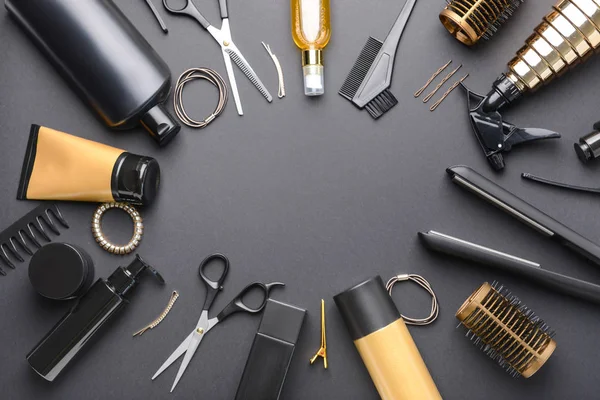 Frame made of hairdresser tools and accessories on dark background — Stock Photo, Image