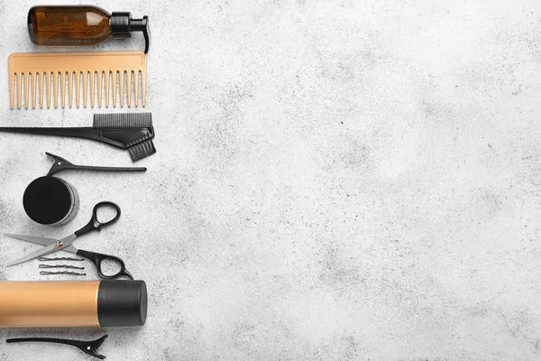 Set of hairdresser tools and accessories on light background — Stock Photo, Image