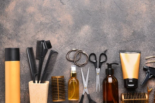 Set of hairdresser tools and accessories on grey background — Stock Photo, Image