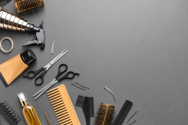 Set of hairdresser tools and accessories on dark background — Stock Photo, Image