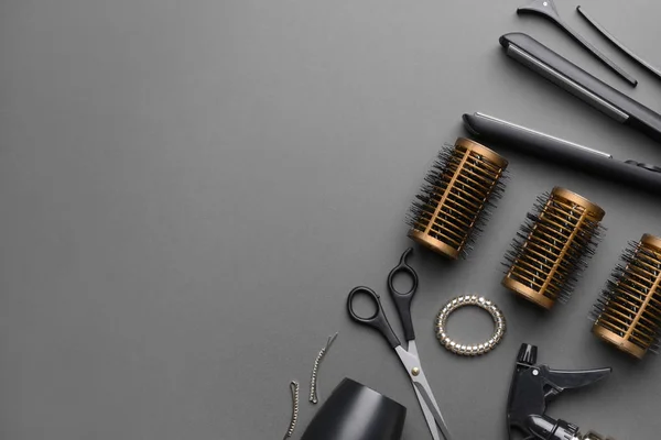 Set of hairdresser tools and accessories on dark background — Stock Photo, Image