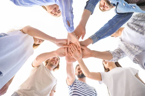 Young people putting hands together at group therapy session, bottom view — Stock Photo, Image