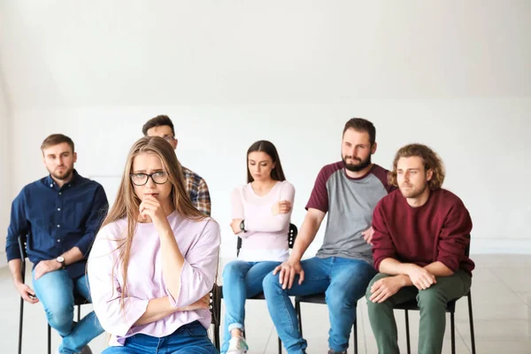 Sad young woman at group therapy session — Stock Photo, Image