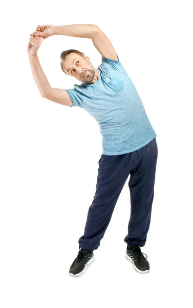 Portrait of handsome mature man doing exercise on white background — Stock Photo, Image