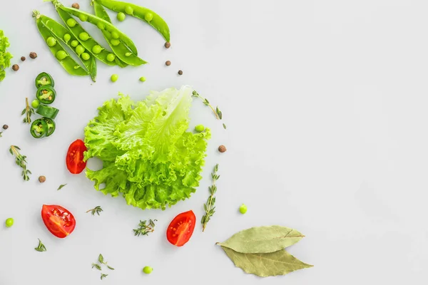 Fresh herbs with vegetables and spices on grey background — Stock Photo, Image