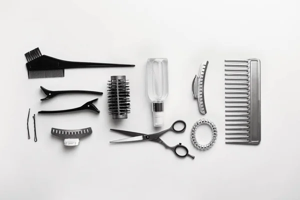 Set of hairdresser tools and accessories on white background — Stock Photo, Image