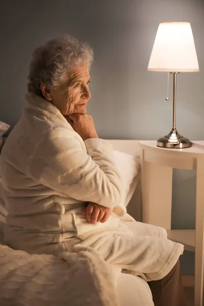Senior woman suffering from insomnia at night — Stock Photo, Image