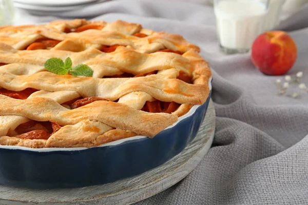 Tasty peach pie on table, closeup