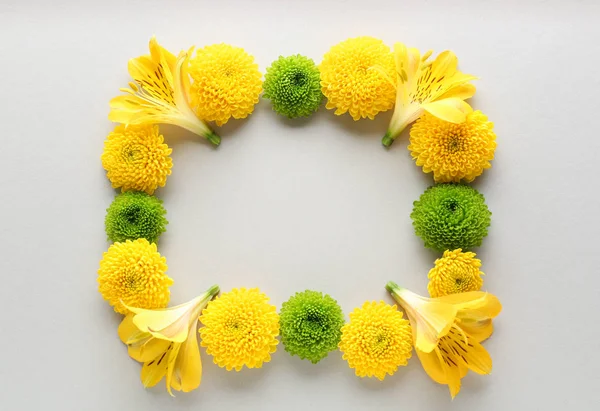 Frame made of beautiful flowers on light background — Stock Photo, Image