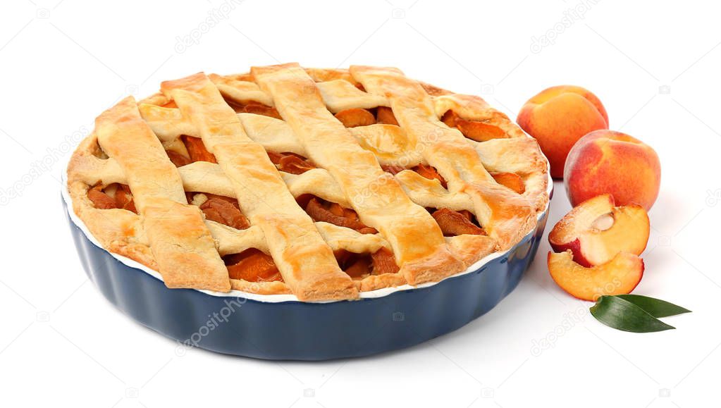 Tasty peach pie on white background