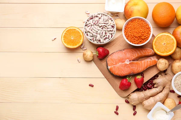 Different healthy food on wooden table — Stock Photo, Image