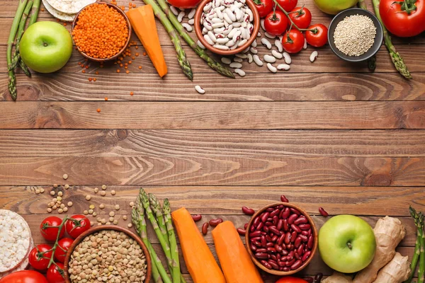 Different healthy food on wooden table — Stock Photo, Image