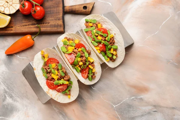 Tasty tacos on marble background — Stock Photo, Image